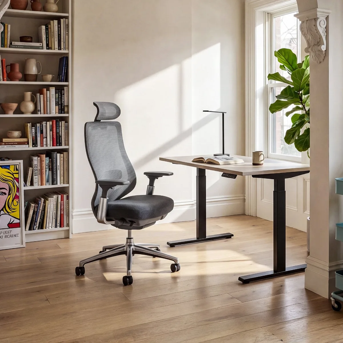 COLAMY ATLAS in Dark Gray beside a light wooden standing desk in a sunlit room with a bookshelf