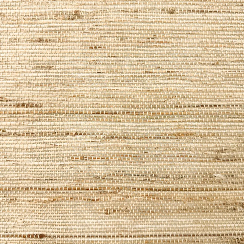 A close-up of the woven ramie fabric of a Neutral Curtains bamboo shade, horizontal strands in sand and straw tones