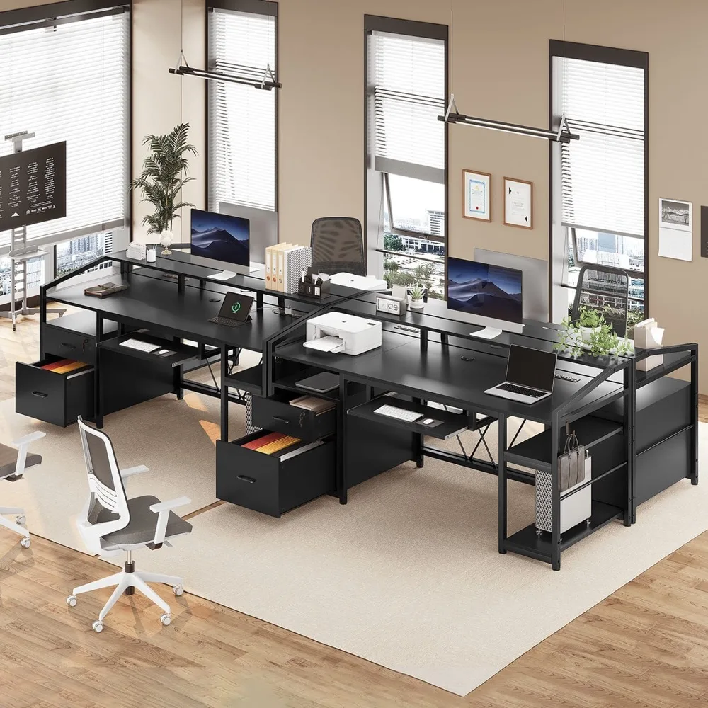 Three of the same desks lined up in a bright office with a task chair and a printer