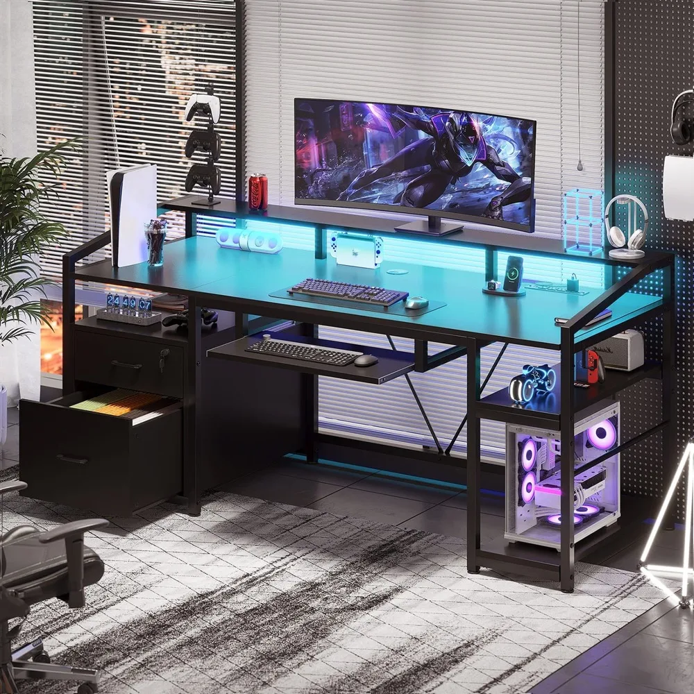 The desk set up as a gaming station with an ultrawide monitor, a keyboard on the sliding tray and a PC tower on the side shelf