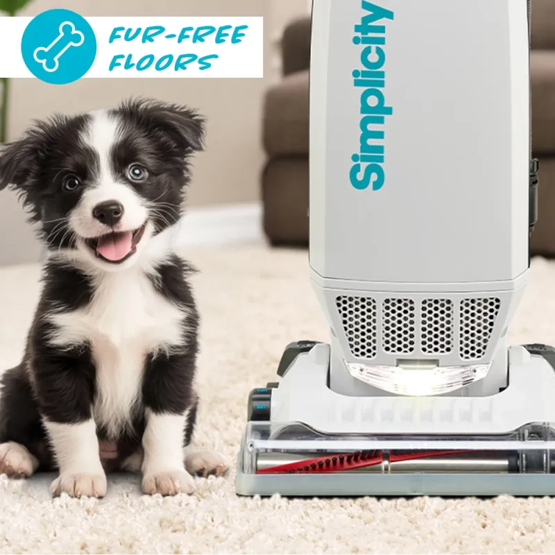 Simplicity's own photo: a black-and-white puppy sitting on a cream rug next to the S20EZM nozzle, the headlight lit and the red brushroll visible through the clear cover, under the caption Fur-free floors